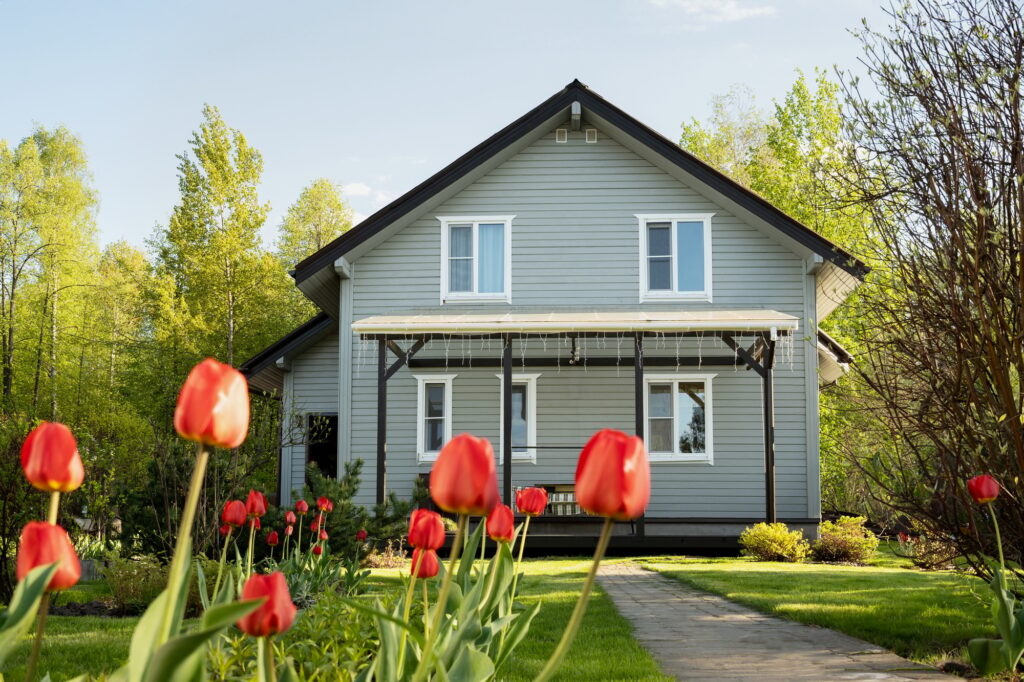 Contemporary house in countryside in spring. Russian dacha in Moscow region.