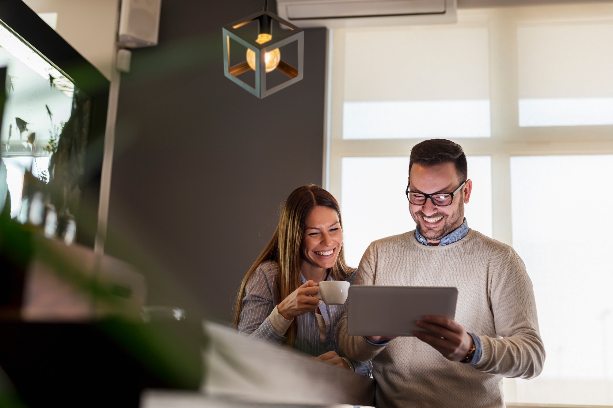 Couple using tablet computer